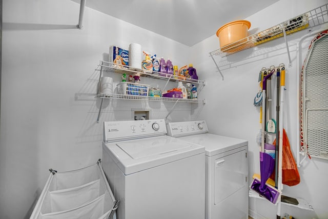 laundry area with separate washer and dryer