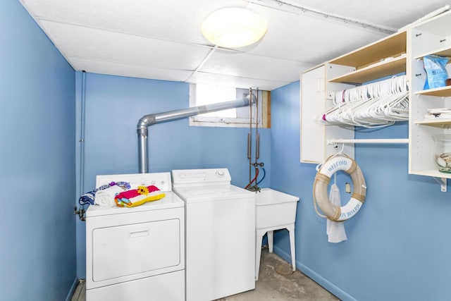 washroom with washing machine and clothes dryer