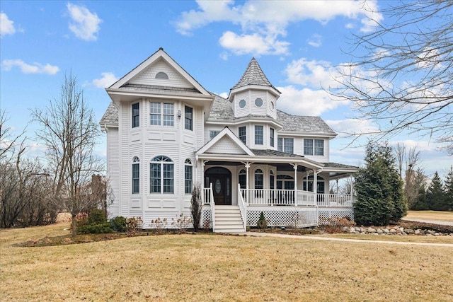 victorian-style house with covered porch and a front lawn