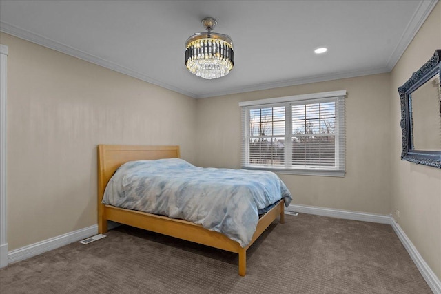 bedroom featuring ornamental molding, a chandelier, and carpet floors