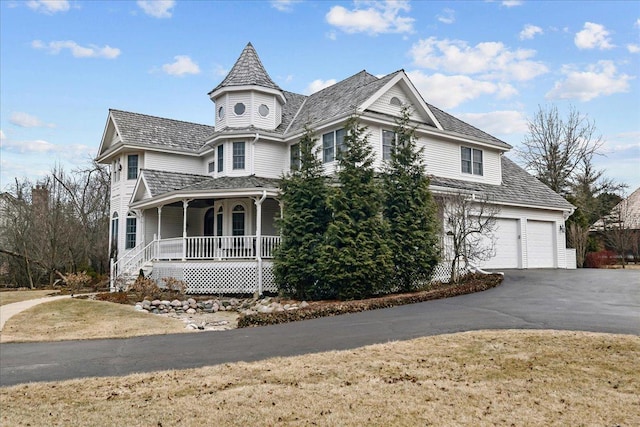 victorian home with a front yard and covered porch