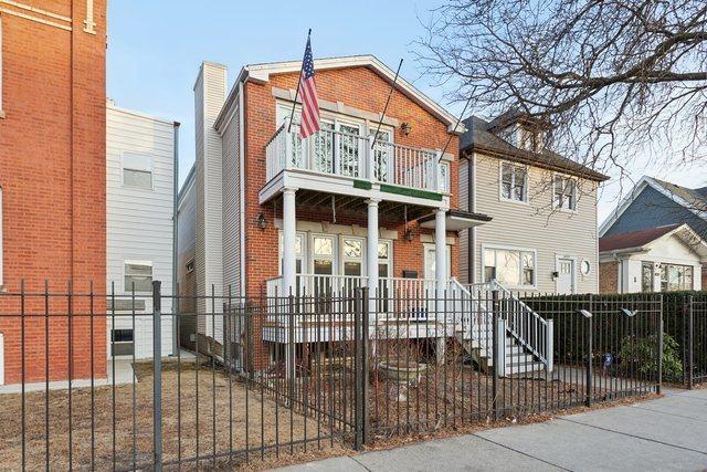 view of front of home with a balcony and covered porch