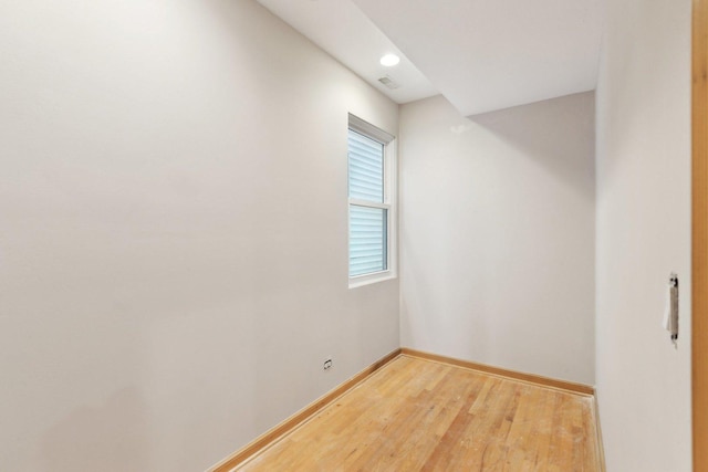 unfurnished room featuring hardwood / wood-style flooring