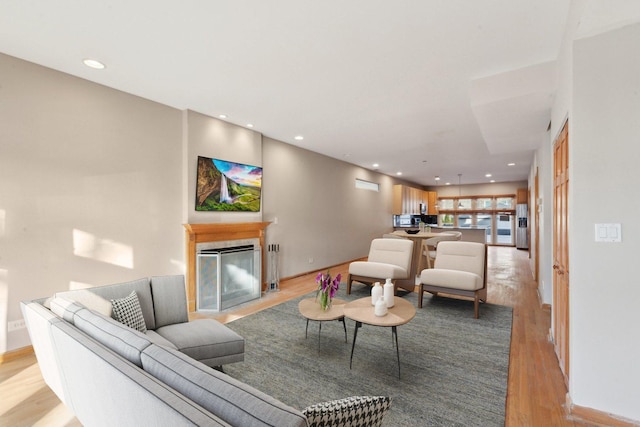 living room with light hardwood / wood-style flooring