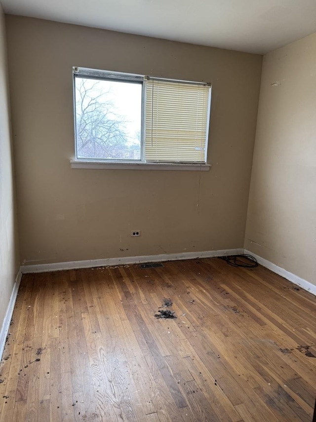 empty room featuring hardwood / wood-style flooring