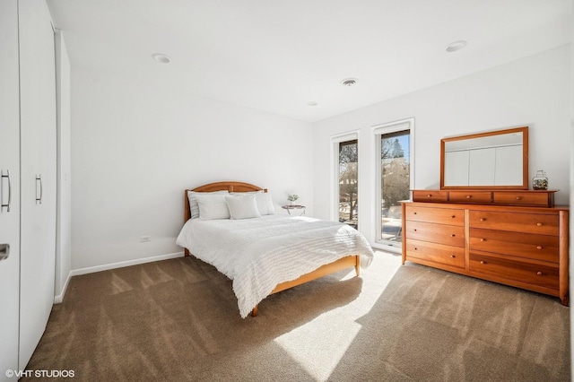 bedroom featuring access to exterior and carpet floors