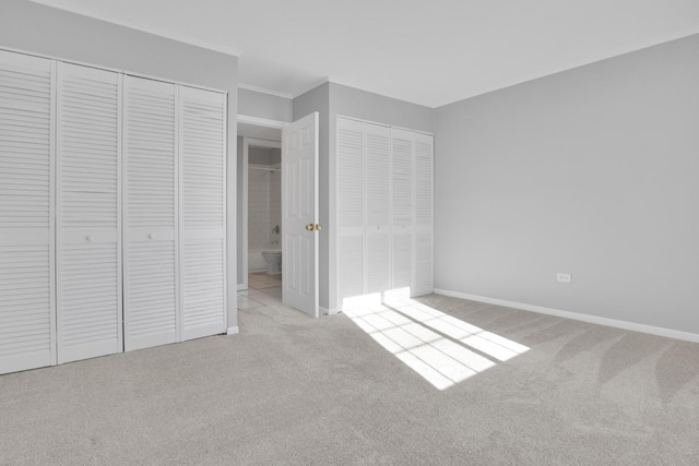 unfurnished bedroom featuring light colored carpet