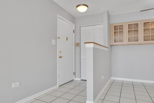 foyer entrance with light tile patterned floors