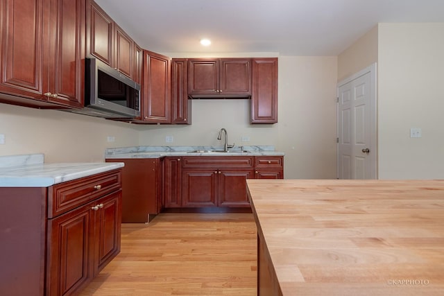 kitchen featuring sink and light wood-type flooring