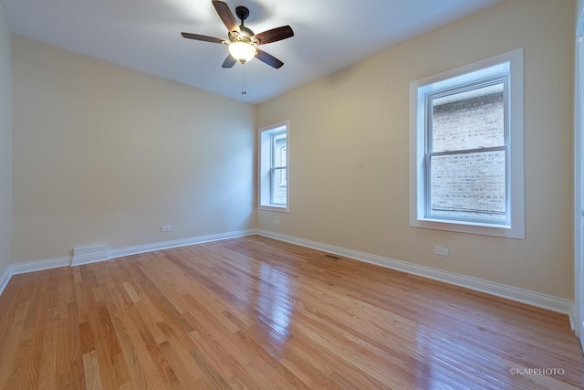 spare room with ceiling fan and light hardwood / wood-style flooring