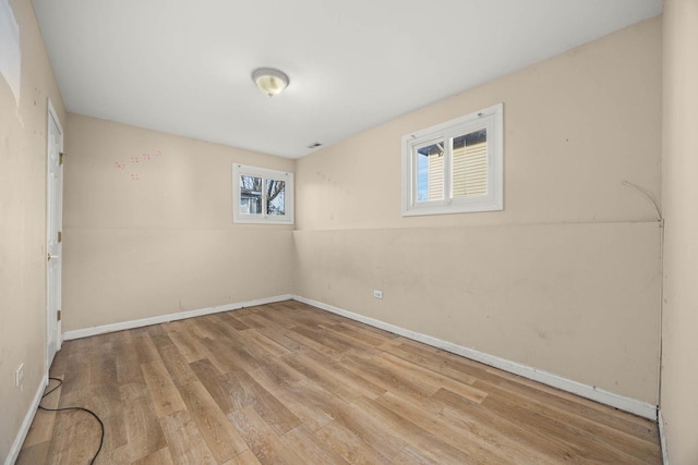 unfurnished room featuring light hardwood / wood-style flooring