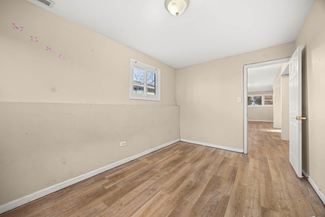 unfurnished room featuring light hardwood / wood-style floors