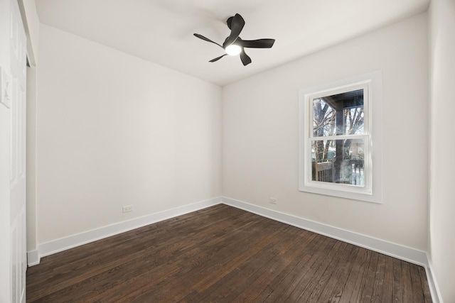 spare room with ceiling fan and dark hardwood / wood-style floors