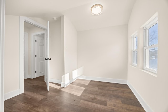 spare room with dark hardwood / wood-style floors