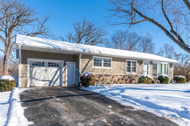 single story home featuring a garage