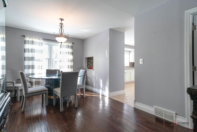 dining area featuring wood-type flooring