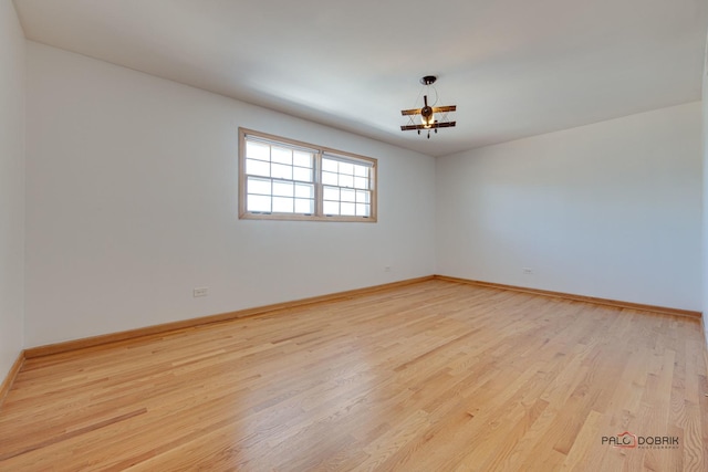 spare room featuring light hardwood / wood-style flooring