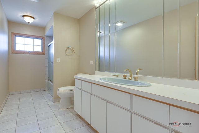 full bathroom featuring vanity, tile patterned floors, toilet, and combined bath / shower with glass door