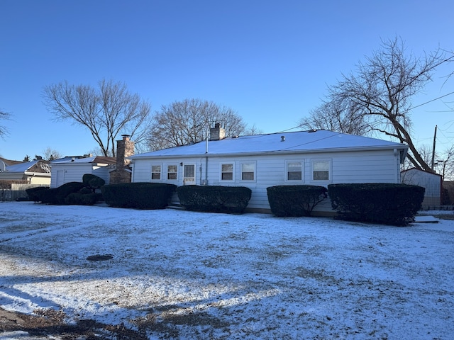 view of snow covered property