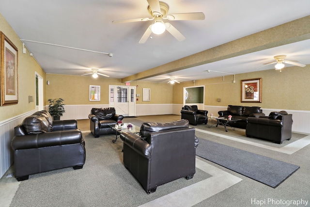 carpeted living room featuring ceiling fan