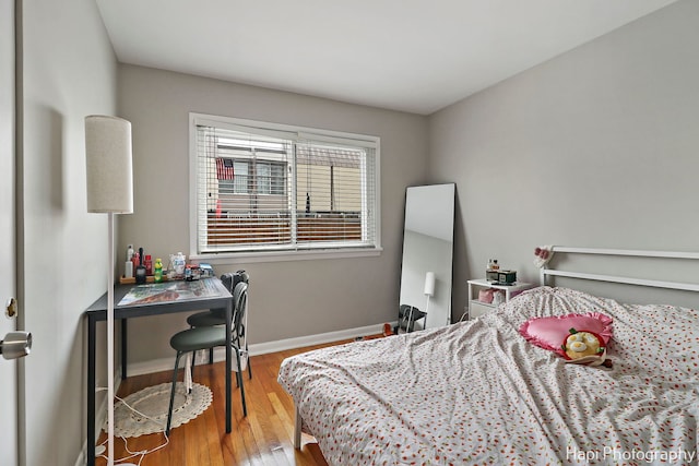 bedroom with wood-type flooring