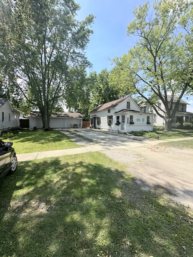 110 S Cherry St, Somonauk, IL 60552 - view of front of house featuring driveway and a front yard