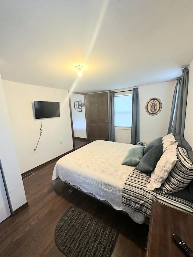 110 S Cherry St, Somonauk, IL 60552 - bedroom featuring dark wood finished floors and baseboards