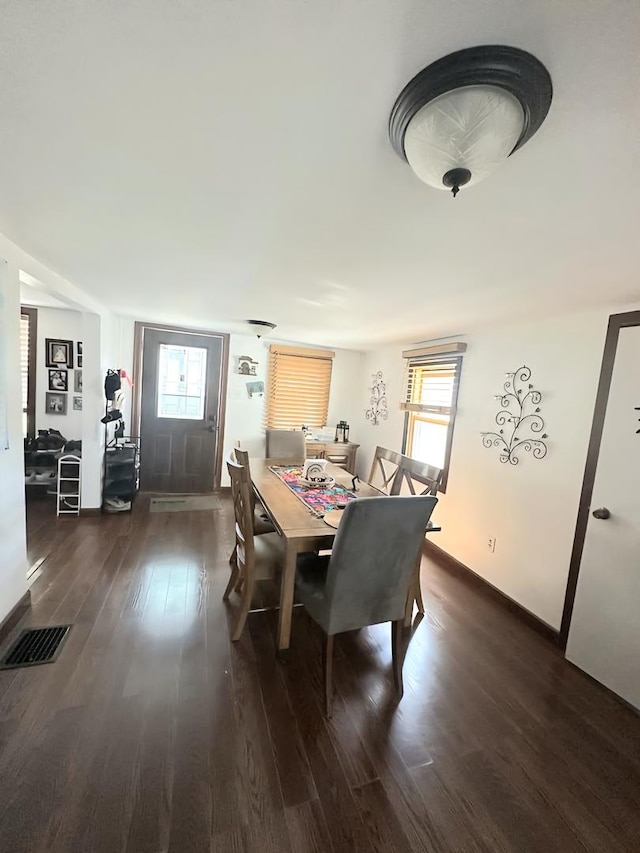 110 S Cherry St, Somonauk, IL 60552 - dining room featuring dark wood-style floors and baseboards