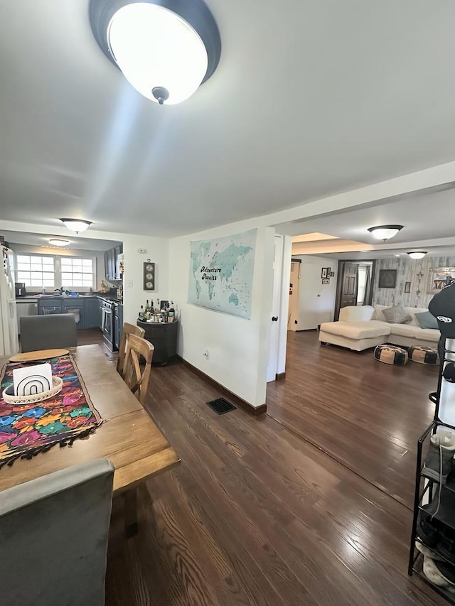 110 S Cherry St, Somonauk, IL 60552 - dining area with dark wood-type flooring and baseboards