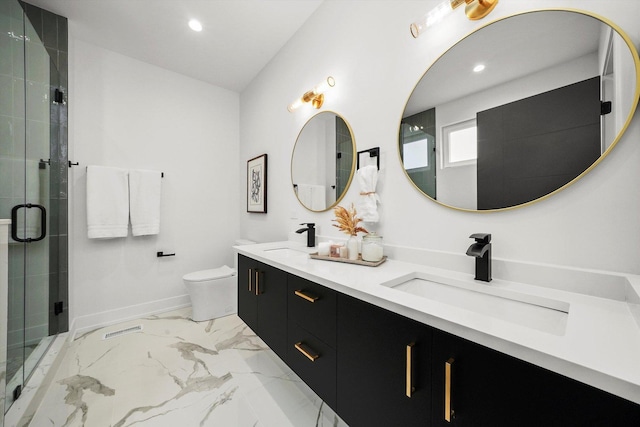 bathroom featuring a shower with shower door, toilet, and vanity