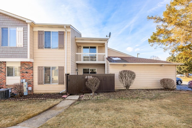 exterior space with a yard and central AC