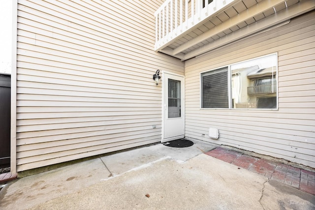 doorway to property featuring a patio area