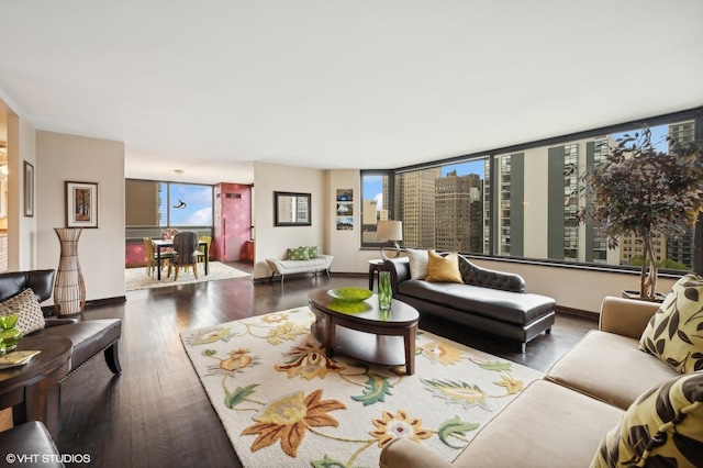 living room with dark hardwood / wood-style flooring