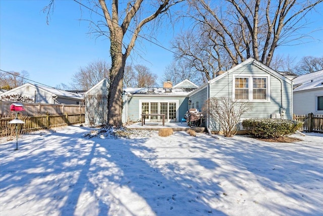 view of snow covered house