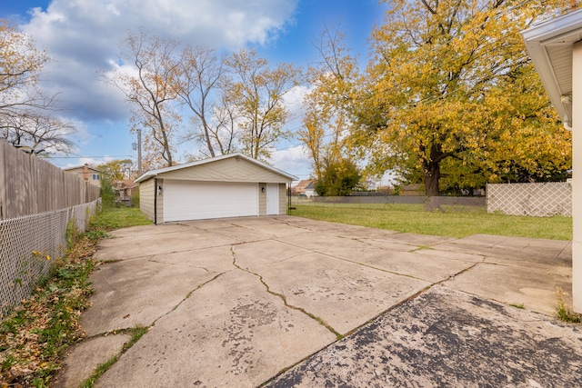 garage featuring a lawn