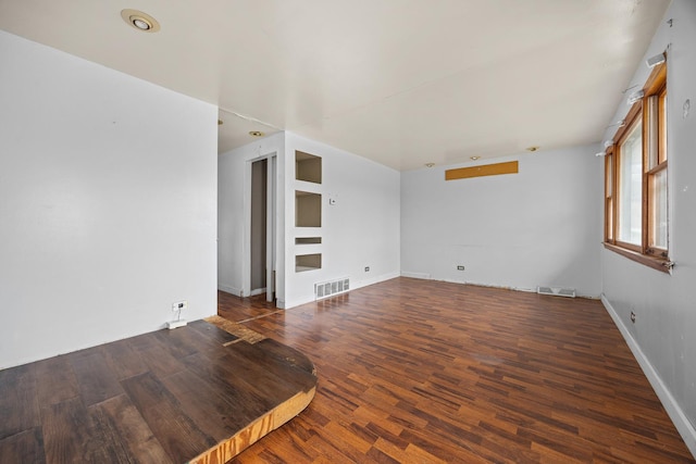 empty room with dark hardwood / wood-style floors