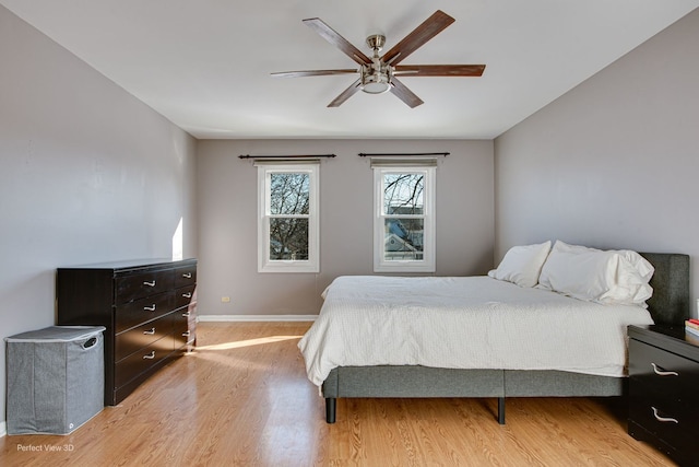 bedroom featuring light wood-type flooring and ceiling fan