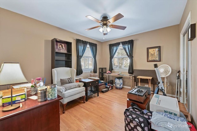 interior space with ceiling fan and light hardwood / wood-style flooring