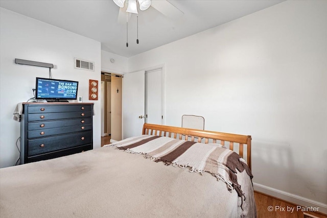 bedroom featuring hardwood / wood-style flooring and ceiling fan