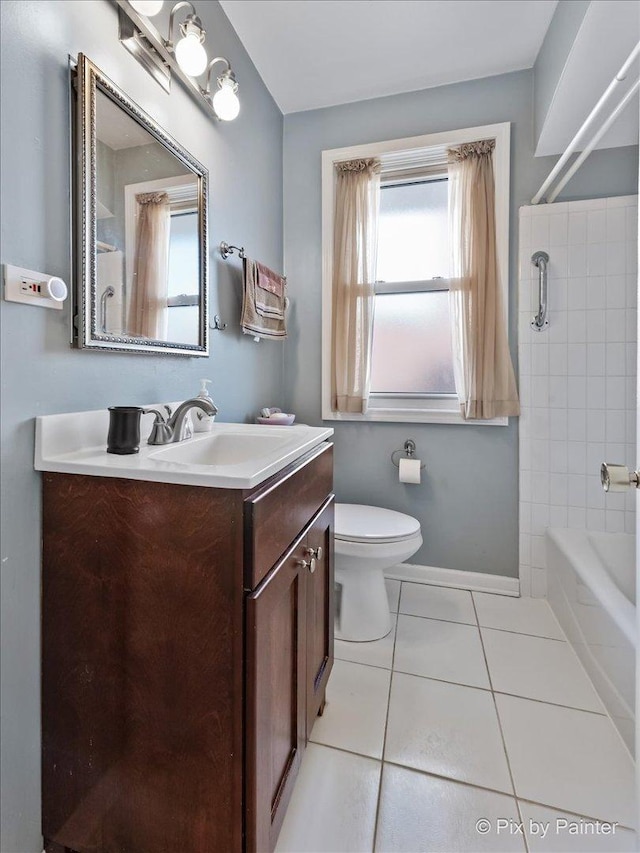 bathroom with vanity, tile patterned floors, and toilet