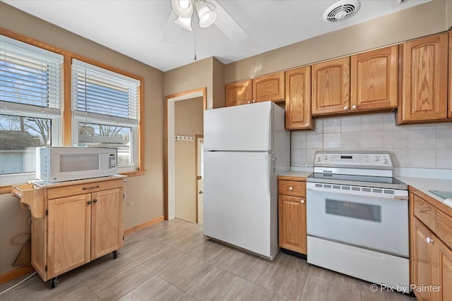 kitchen with tasteful backsplash, white appliances, and ceiling fan