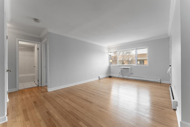 unfurnished room with crown molding, a baseboard radiator, and light hardwood / wood-style flooring