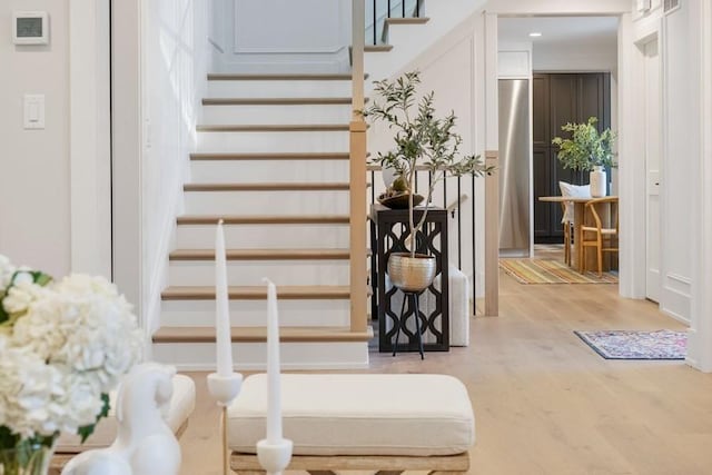 stairs with hardwood / wood-style floors