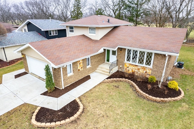 view of front of home with a garage and a front yard