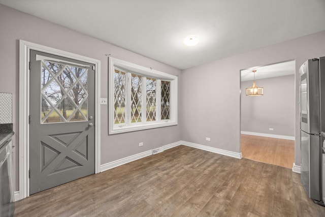 entryway with wood-type flooring