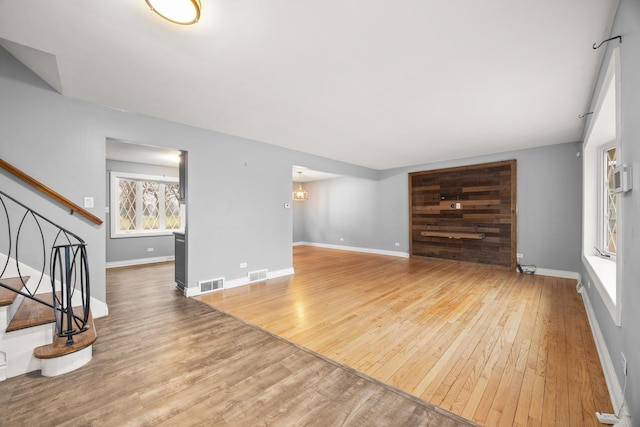 unfurnished living room featuring wood-type flooring