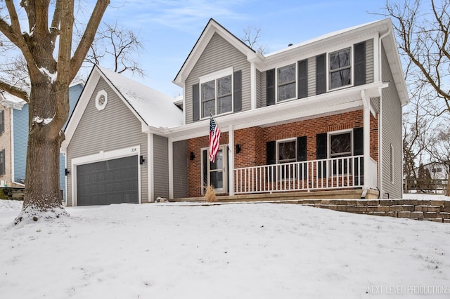 view of front facade with a garage and covered porch