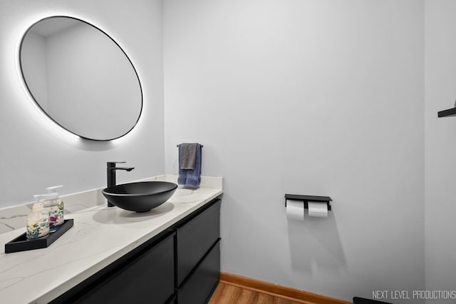 bathroom featuring vanity and wood-type flooring