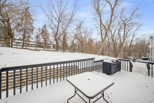 snow covered deck with area for grilling