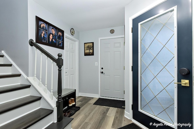 entryway with hardwood / wood-style flooring